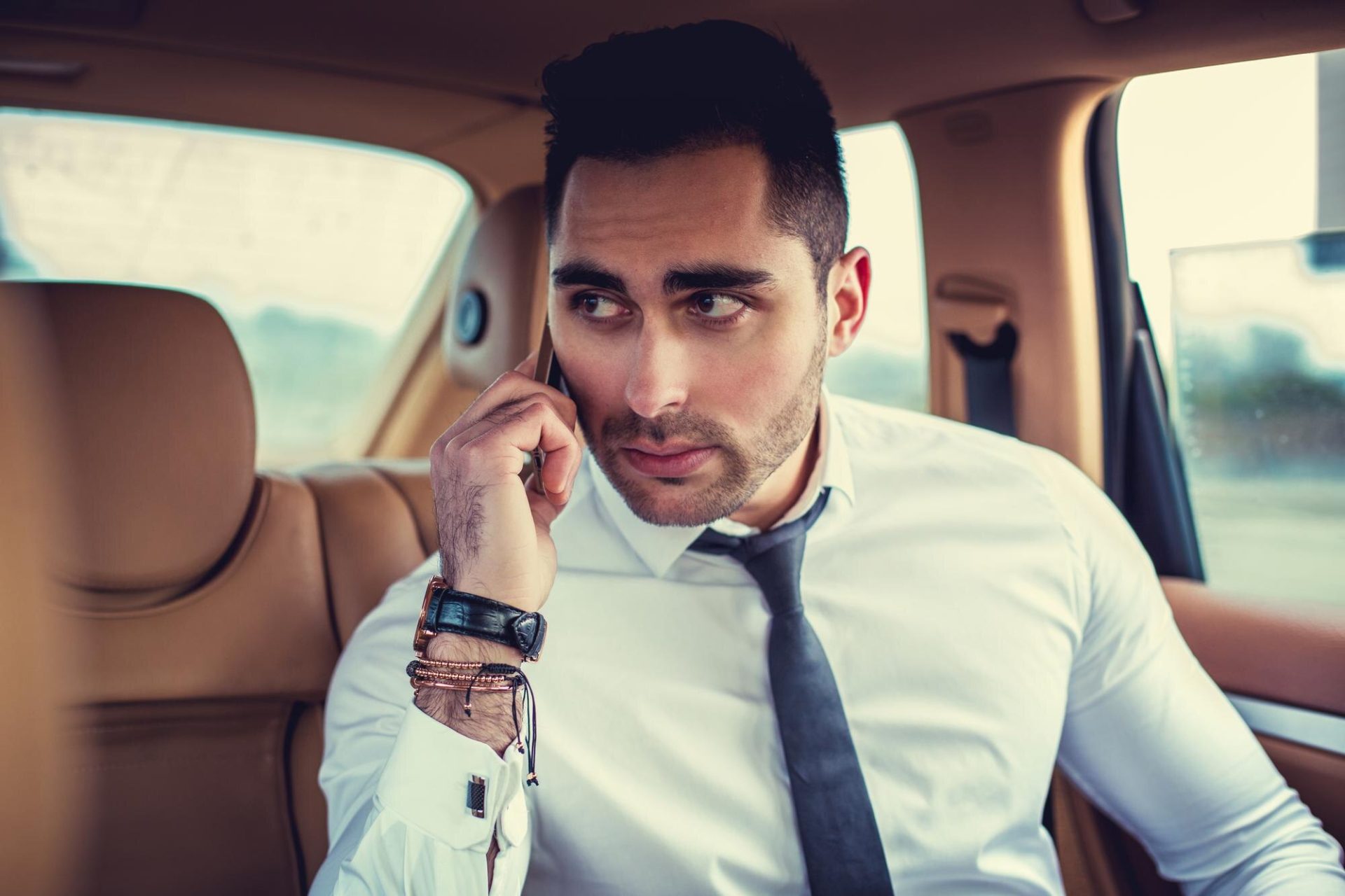 The Savoy Hotel chauffeur service London — Luxelimo chauffeur-driven luxury car at The Savoy, Strand