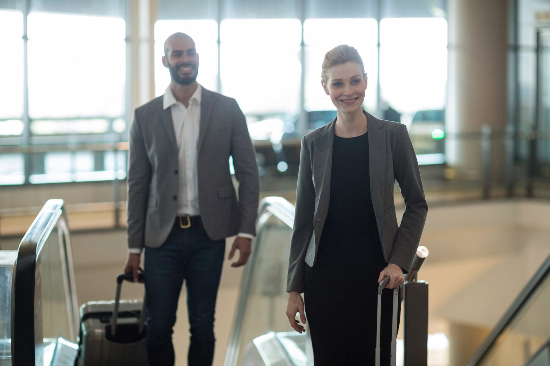 Luxelimo meet and greet chauffeur service London — driver with name board in arrivals hall